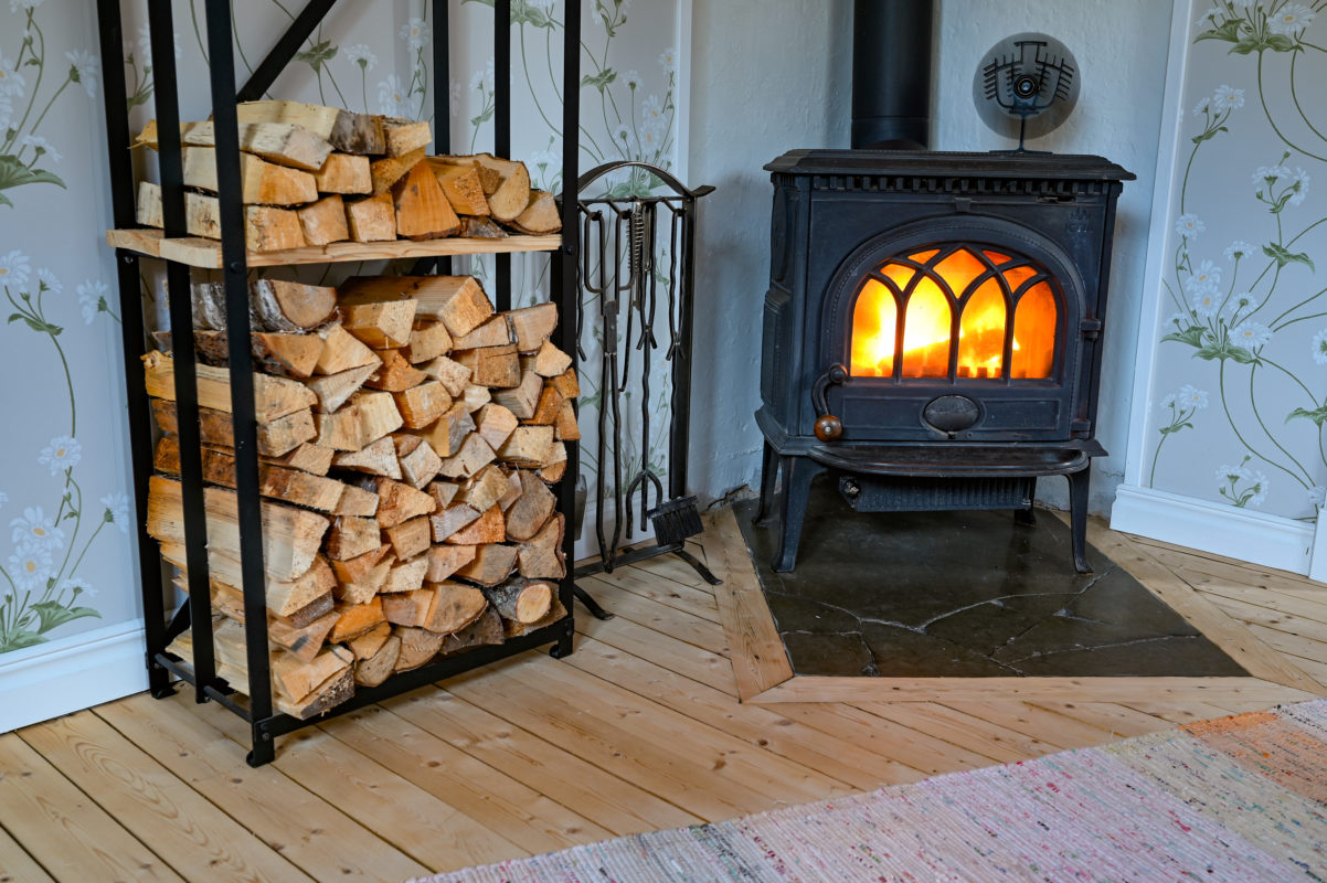 cast iron stove with small fan on top | Buy Firewood Direct Ireland | Kiln Dried Logs For Sale